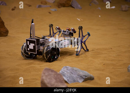 A small scout prototypes for the ESA ExoMars rover mission to Mars is tested by Airbus in a warehouse made to look like the Red Planet Stock Photo