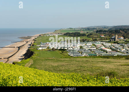 A landscape view of the Norfolk Coast UK at Beeston Regis showing a large static caravan or mobile home site Stock Photo