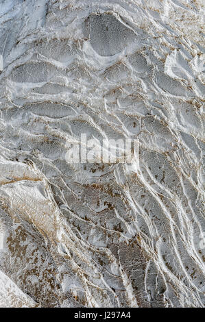 Ice crystals and surface hoar formed from overnight freeze on high alpine rockface in winter. Stock Photo