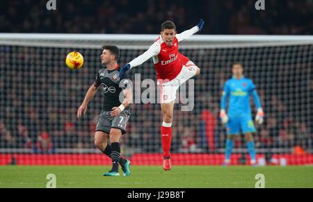 Arsenal's Gabriel Paulista challenges Shane Long of Southampton during the EFL Cup Quater-final match between Arsenal and Southampton at the Emirates Stadium in London. November 30, 2016. EDITORIAL USE ONLY - FA Premier League and Football League images are subject to DataCo Licence see www.football-dataco.com Stock Photo
