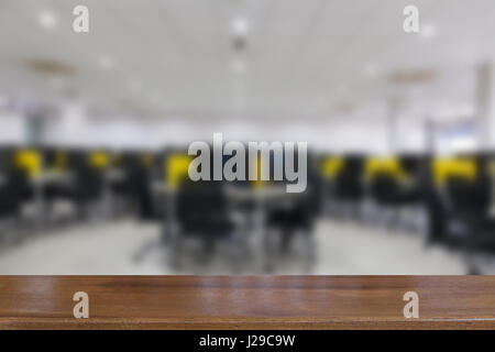 Group of computer neatly placed in a computer study lab room at the university or college, blur background with selective focus wood table for display Stock Photo