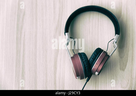 Wood office desk with headset headphone, top veiw with copy space Stock Photo