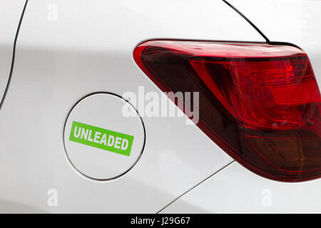 UNLEADED: Fuel cap on a car that takes unleaded. Stock Photo