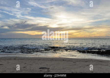 View of the sunset from Sunset Beach on Mana Island in Fiji Stock Photo