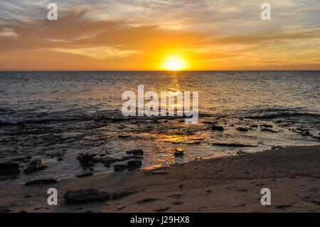 View of the sunset from Sunset Beach on Mana Island in Fiji Stock Photo