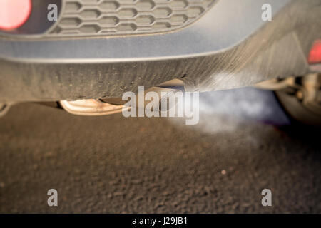 Car exhaust fumes causing health problems and environmental concerns Stock Photo