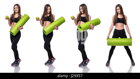 Young attractive fitness woman ready for workout holding green yoga mat isolated on white background. Composite image Stock Photo