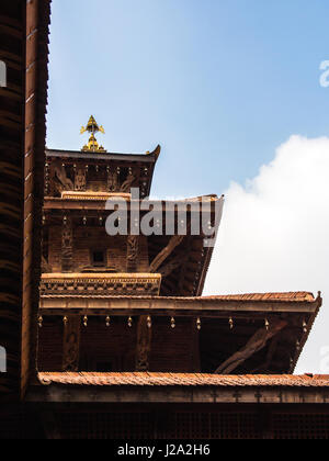 Looking up towards one of the multi leveled pagodas in historic Durbar Square in Patan. Kathmandu, Nepal. Stock Photo