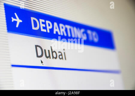 Computer screen close-up of status of flight departing to Dubai, United Arab Emirates Stock Photo