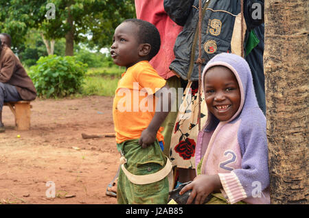 Malawi, Mzimba district, Chilumba Community Based Childcare Centre (CBCC). Smiling children playing on wooden swing Stock Photo