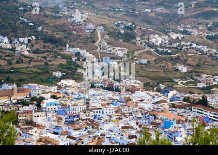 Africa, Chefchaouen, A water fountain stands in the middle of a small square. 'The Blue City' or 'Blue Medina' is a small city of about 40,000 inhabitants, situated in the heart of Morocco's Rif Mountains and located in northeastern Morocco. Stock Photo