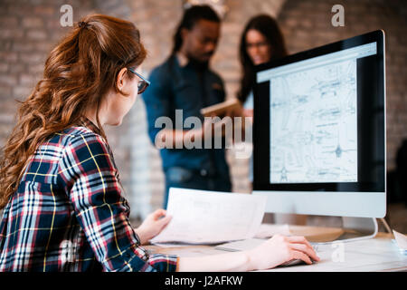 Company employees working in software development and designer office Stock Photo