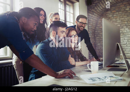 Company employees working in software development and designer office Stock Photo