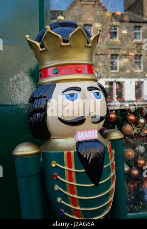 A large nutcracker Christmas figurine standing outside a shop selling christmas decorations in Edinburgh, Scotland, UK Stock Photo