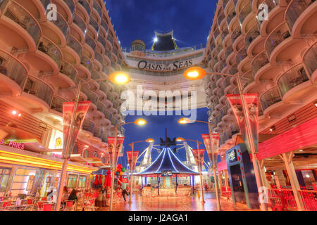 Orlando, USA - Feb, 11: Royal Caribbean, Oasis of the Seas, the largest passenger ship constructed in the world. View of the Boardwalk area in the twi Stock Photo