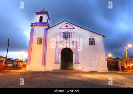 PORTOBELO, PANAMA - APR 15: The large white church at Portobelo is the Iglesia de San Felipe, which is still in use. It dates from 1814, but its tower Stock Photo