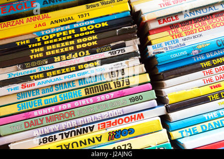 A selection of Childrens comic book annuals from the 1970s and 1980s in a second hand bookshop, UK Stock Photo