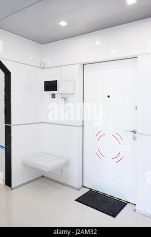 Modern home hallway interior. White plactic panels and tiles. Futuristic interior concept design. Space ship at home.