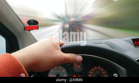 First Person View of Driver Behind the Wheel During Driving a Car. Point of View Shot of Driving a Car. Drivers POV shot. Stock Photo