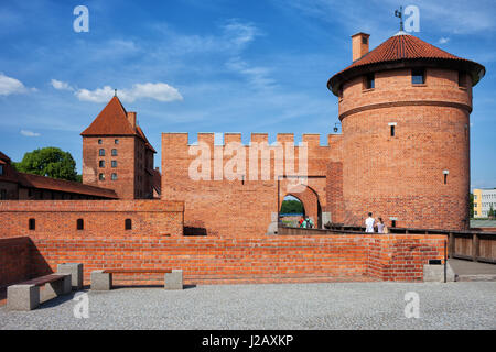 Tower and wall of Malbork Castle outer fortification in Pomerania, Poland, Europe Stock Photo