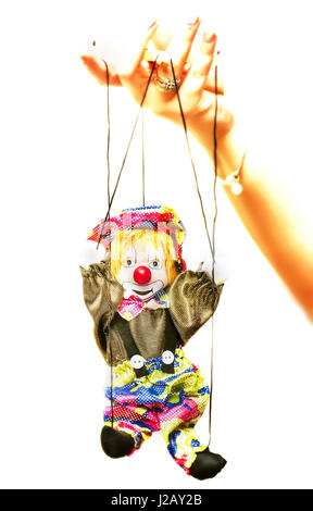 Doll puppet on strings in hand isolation on white Stock Photo