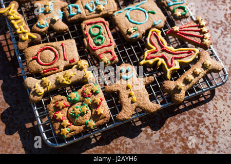 High angle close up of Gingerbread Men on a baking tray. Stock Photo by  Mint_Images