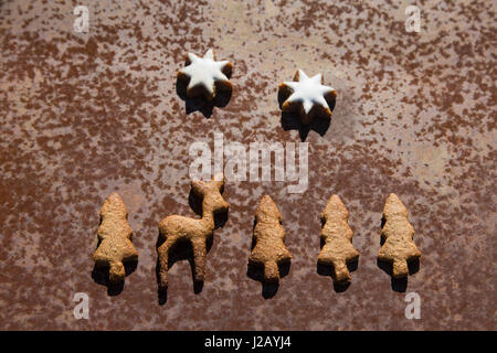 Directly above shot of gingerbread cookies on rusty metal Stock Photo