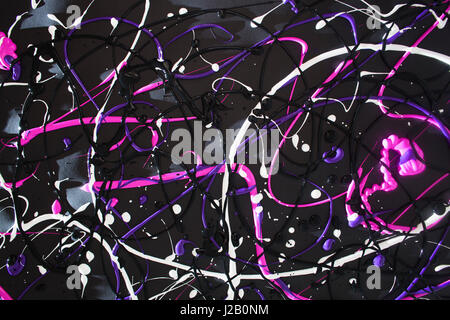 Full frame shot of multi colored paint spilled on black background Stock Photo