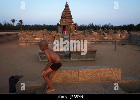 A child plays in front of Shore Temple Stock Photo
