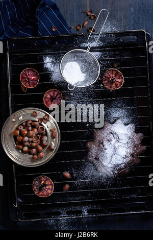 Brownie, chocolate cake with hazelnuts on a baking tray. Bakery. Top view, copy space. Stock Photo