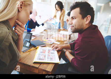 Two colleagues making a comparison Stock Photo