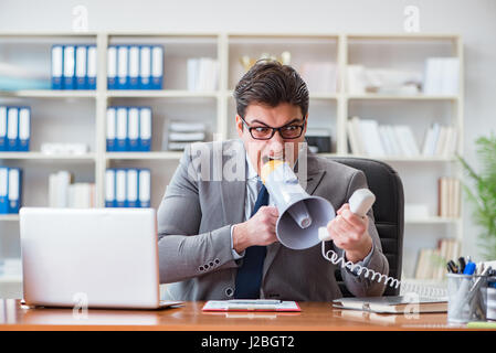 Angry aggressive businessman in the office Stock Photo