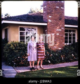 Slides 35 mm to photograph. Vintage look with females at front of home visiting in California. Stock Photo