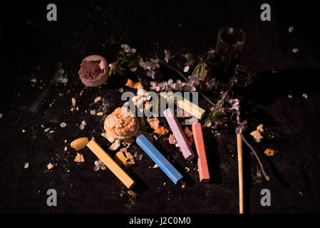 Art with food and chalk on the black background. Stock Photo