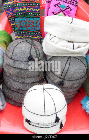 Georgia, Mtskheta. A collection of traditional hats for sale as souvenirs. Stock Photo