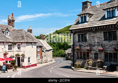 Charming looking public houses on opposite sides of the main road offering refreshments in the form of food and drinks in Corfe Castle village Stock Photo