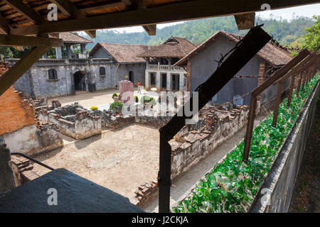 Vietnam, Son La, Old French Prison, walls with broken glass Stock Photo