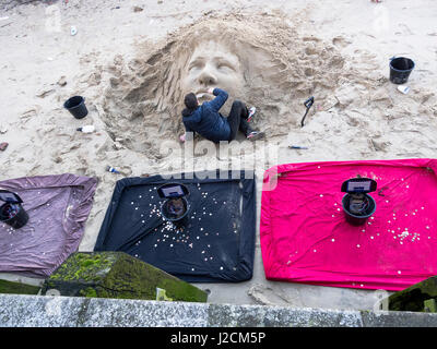 A street artist with his sand sculptures on the South Bank of the River Thames in London Stock Photo