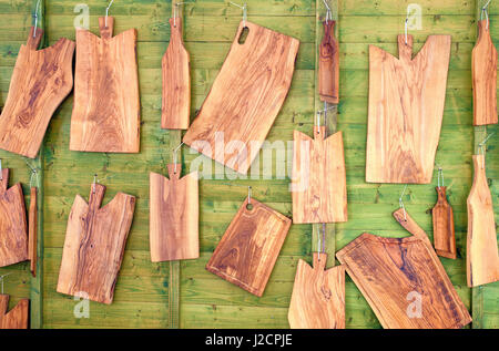 wooden cutting boards on green background Stock Photo