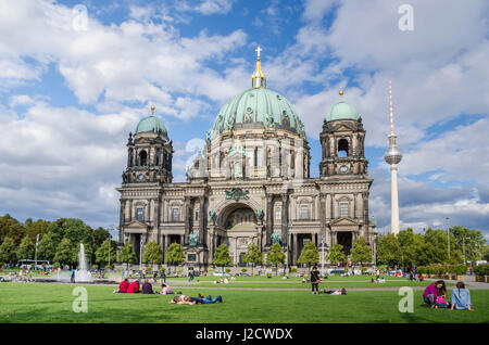 Berlin, Germany -  September 8, 2015: the Berlin Cathedral (in German, 'Berliner Dom'), designed by Julius Carl Raschdorff. People enjoying the warm a Stock Photo