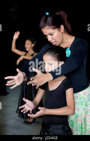 Cuba, Havana, girls rehearsing with teacher at ballet and folkloric dance school. (Editorial Use Only) Stock Photo