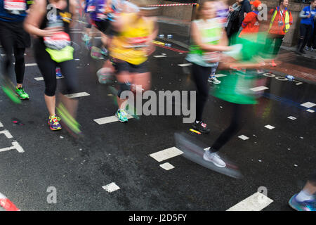 Participants taking part in the London Marathon running some four miles to go to complete the race on 23rd April 2017 in London, England, United Kingdom. Stock Photo