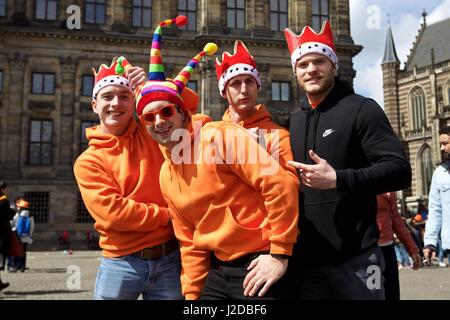 Amsterdam, Netherlands. 27th Apr, 2017. People celebrate the Netherlands' traditional King's Day at the Dam Square in front of the Royal Palace in Amsterdam on April 27, 2017. The Dutch's King's Day is the birthday of the incumbent King or Queen. Credit: Sylvia Lederer/Xinhua/Alamy Live News Stock Photo