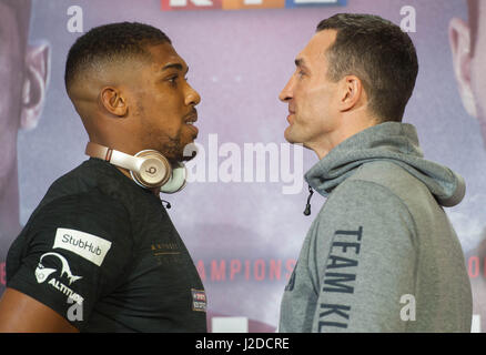 London, UK. 27th April 2017. Anthony Joshua and Wladimir Klitschko pose during the press conference. Anthony Joshua and Wladamir Klitschko are due to fight for the IBF, IBO and WBA Super Heavyweight Championships of the World at Wembley Stadium on Saturday, the 29th of April 2017. Credit: Michael Tubi/Alamy Live News Stock Photo