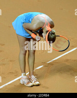 Stuttgart, Germany. 28th Apr, 2017. Kristina Mladenovic from France celebrates her win during the women's singles match in the Porsche Tennis Grand Prix in the Porsche Arena in Stuttgart, Germany, 28 April 2017. Photo: Bernd Weissbrod/dpa/Alamy Live News Stock Photo