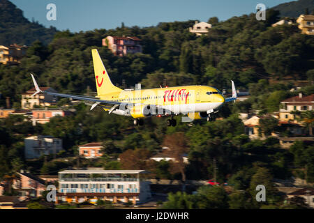 Corfu, Greece - August 18, 2015: TUIfly Boeing 737-800 landing on runway of Corfu International Airport. Stock Photo