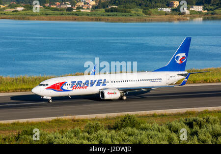 Corfu, Greece - August 18, 2015: Travel service Boeing 737-800 taking off from Corfu International Airport. Stock Photo