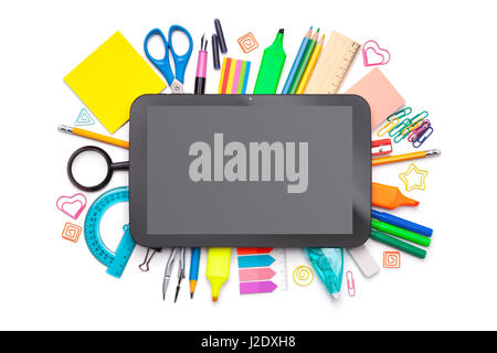 School concept. Tablet over school supplies isolated on white background. Top view Stock Photo