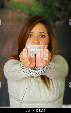 Terrified young girl kidnapped and bonded Stock Photo - Alamy