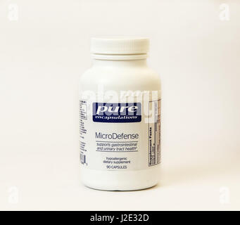 Bottle of urinary tract medication isolated on white. Stock Photo